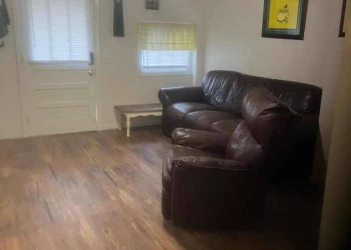 The Clubhouse Masters Golf Themed 1 King Bed 1 Bath Furnished Apartment Full Size Kitchen Full Size Leather Pull Out Sleeper Sofa In Living Room & Full Size Leather Sofa 1 Gig Fiber Internet Directv Premium Package All Sports & Movie Channels & Dvr